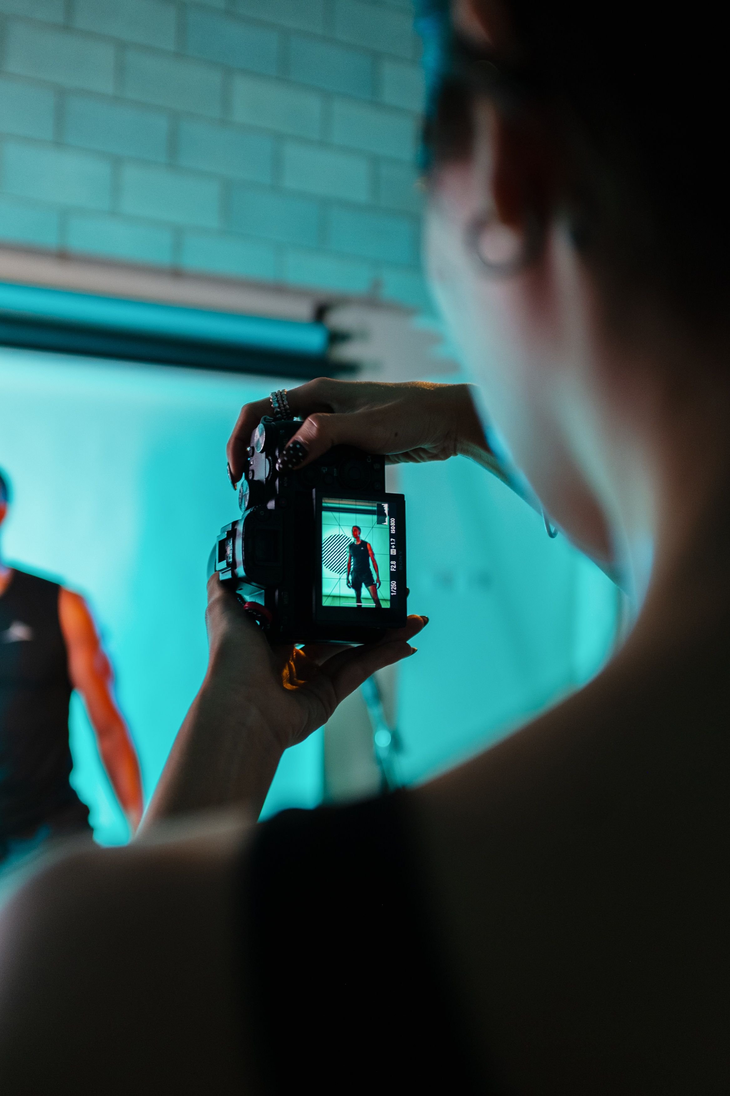Photographer directing a client during a studio session